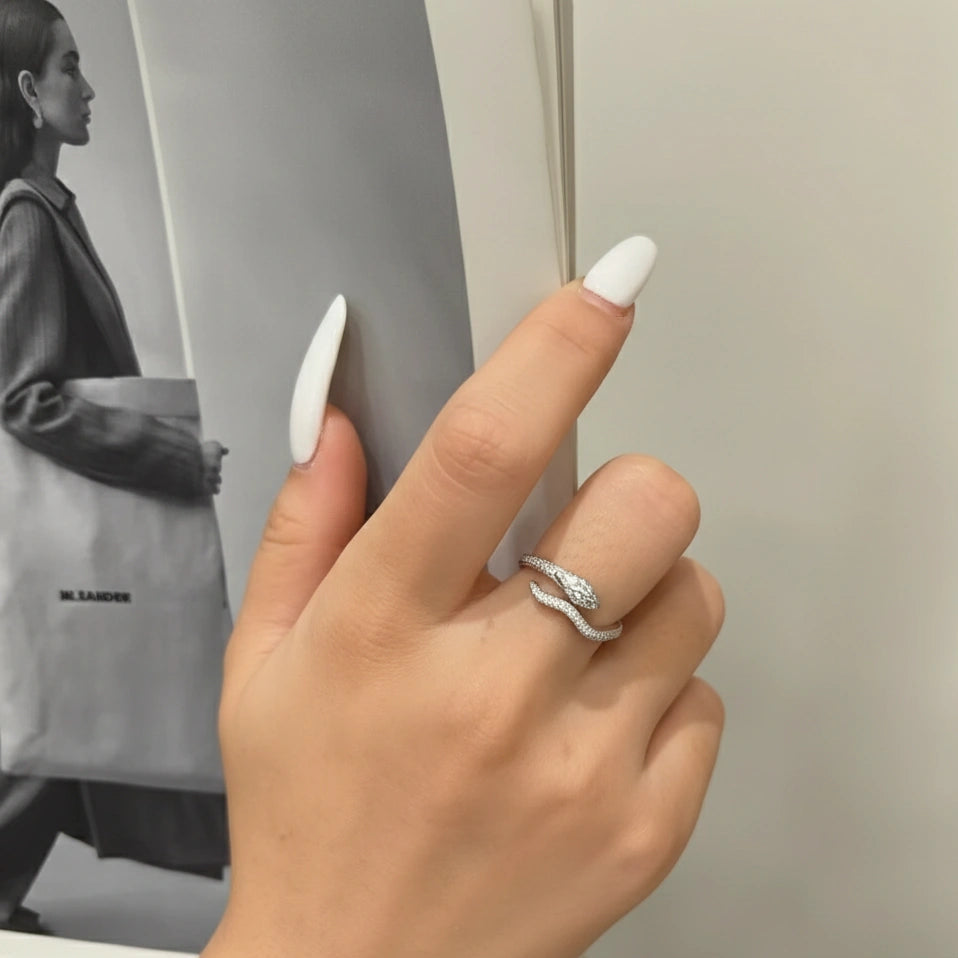 Snake Half Eternity Moissanite Ring in white gold worn on hand in editorial-style photo - Sensitive Stones