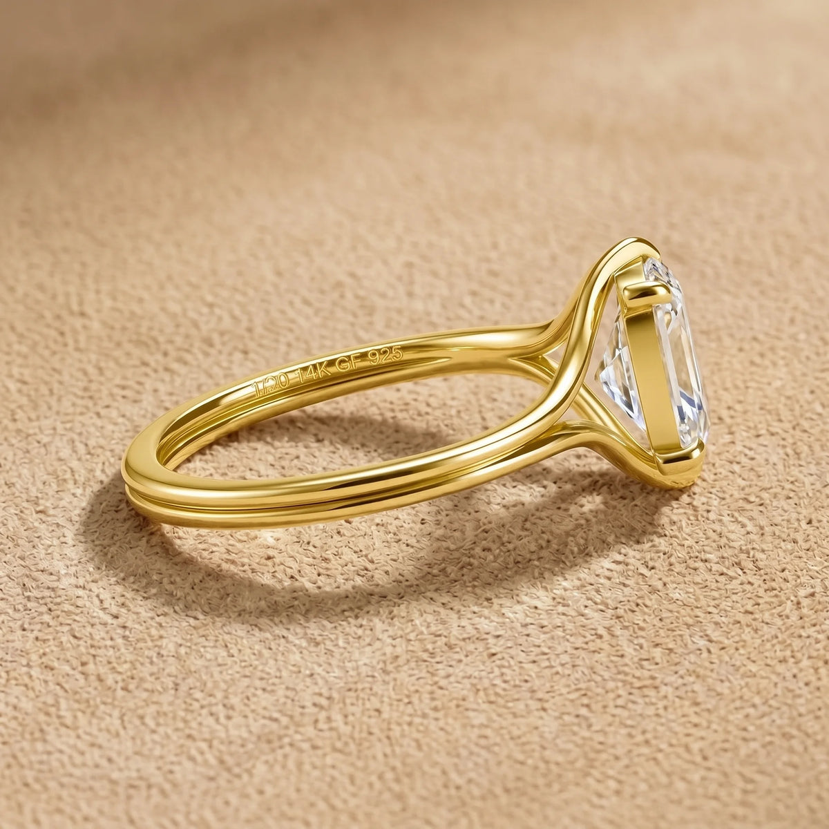 Split shank oval moissanite engagement ring in 14K gold filled seen from the side, showing the two band strands sweeping up to the raised setting and the 1/20 14K GF 925 hallmark - Sensitive Stones