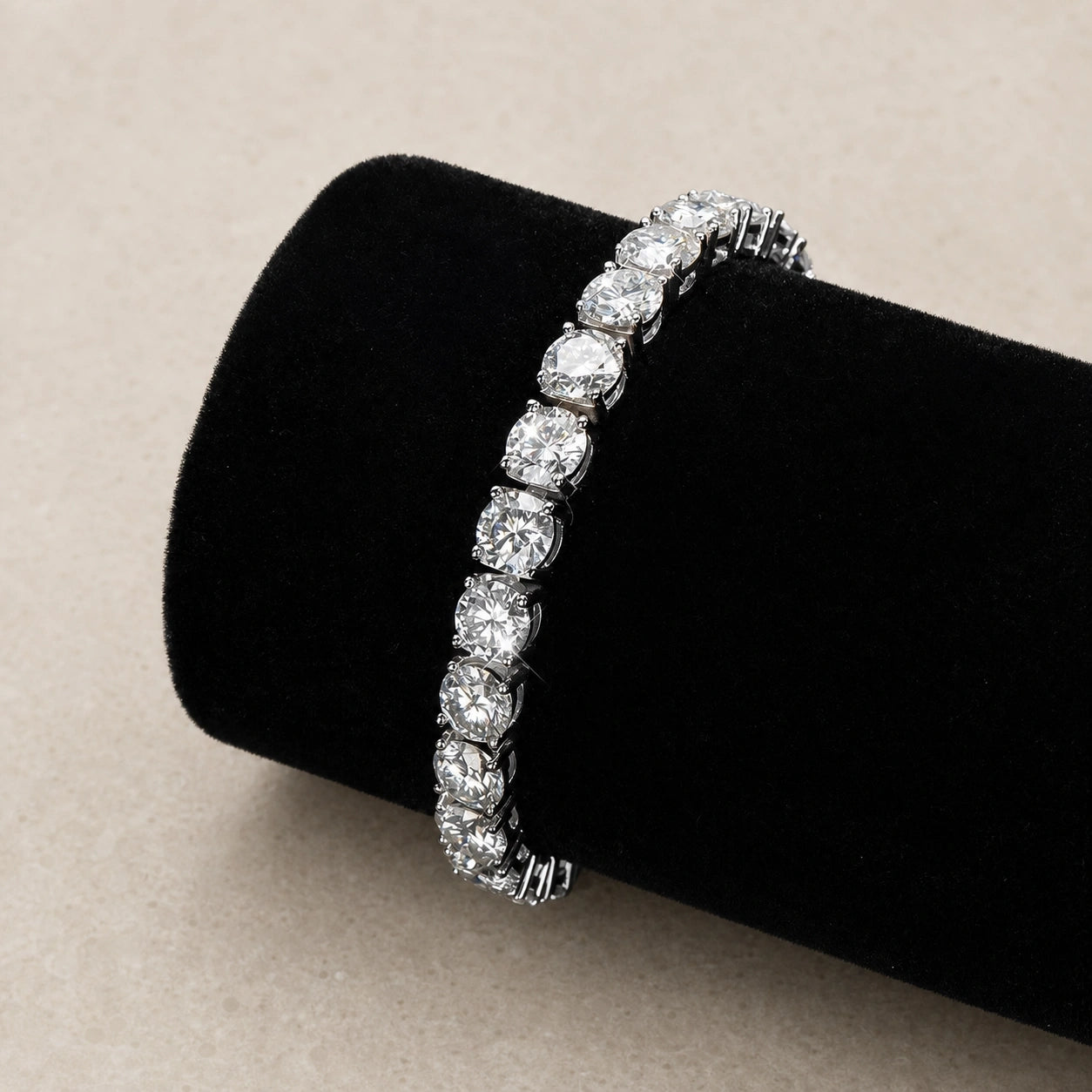 Statement moissanite tennis bracelet in 18K white gold displayed on a black velvet stand - Sensitive Stones