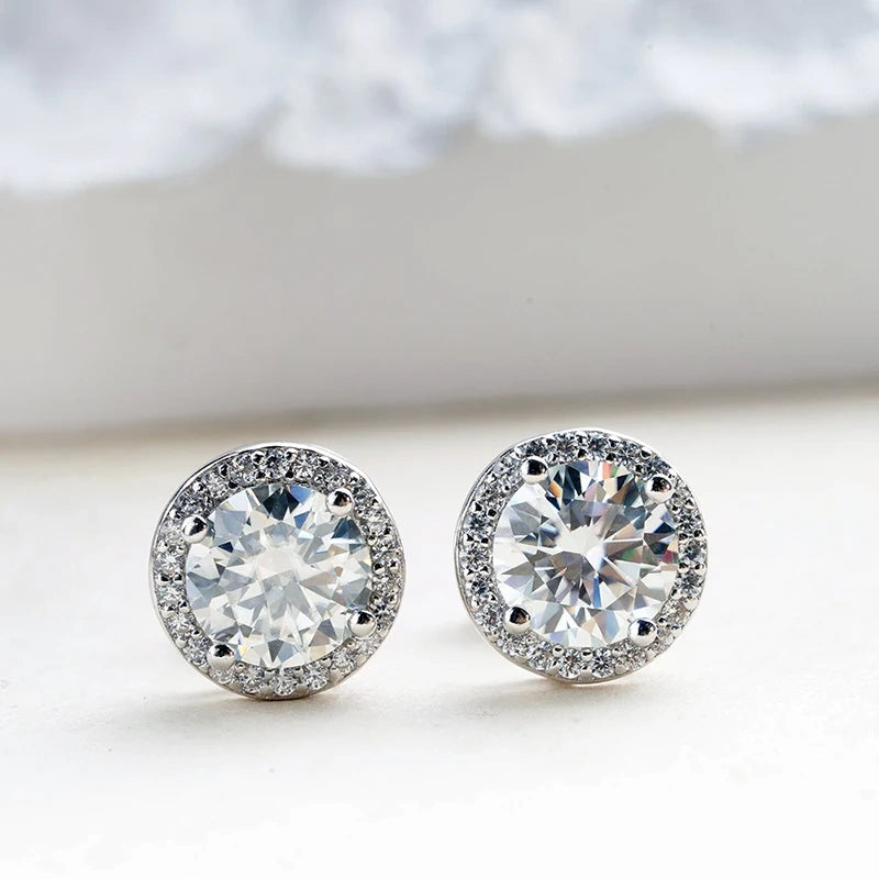 White moissanite halo stud earrings in 925 sterling silver on neutral background - Sensitive Stones