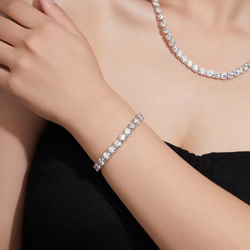 Close-up of a model’s bare wrist wearing a white moissanite tennis bracelet – Sensitive Stones