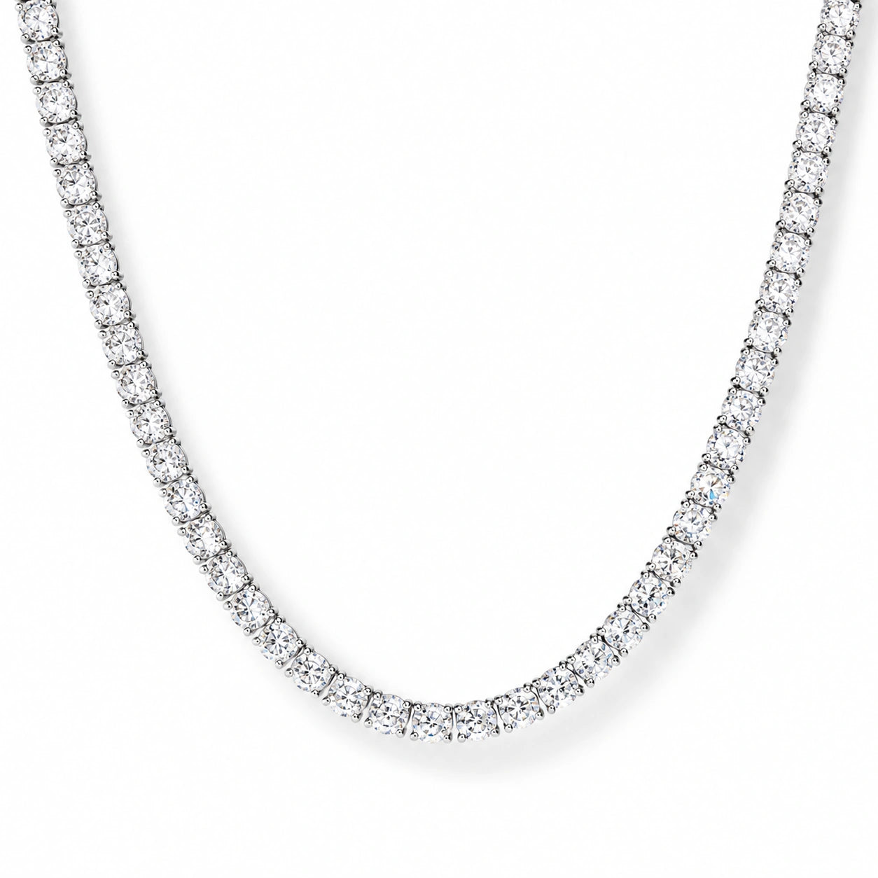 White moissanite tennis necklace close-up on white background, white gold plated 925 sterling silver, 4-prong round stones - Sensitive Stones