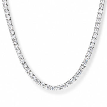 White moissanite tennis necklace close-up on white background, white gold plated 925 sterling silver, 4-prong round stones - Sensitive Stones
