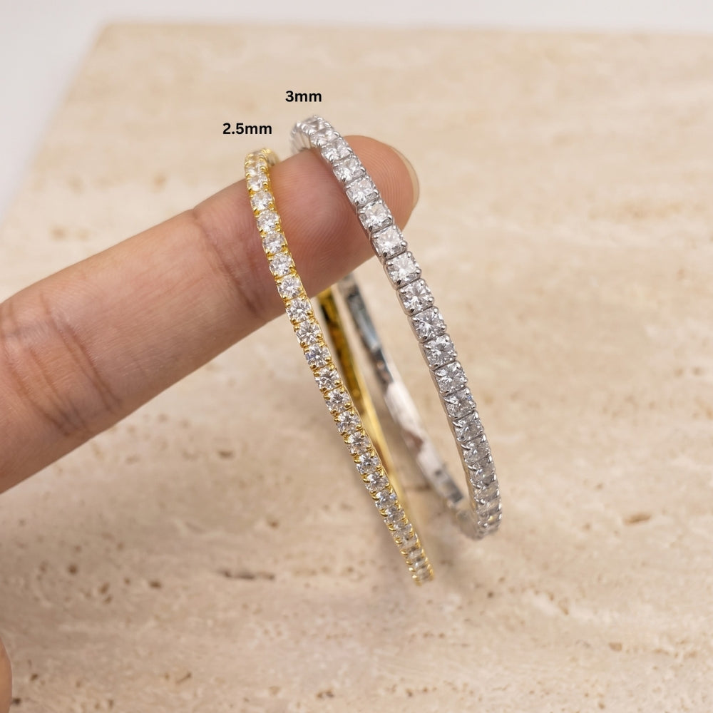 Yellow gold and white gold stretch moissanite tennis bracelets side by side comparing 2.5mm and 3mm - Sensitive Stones